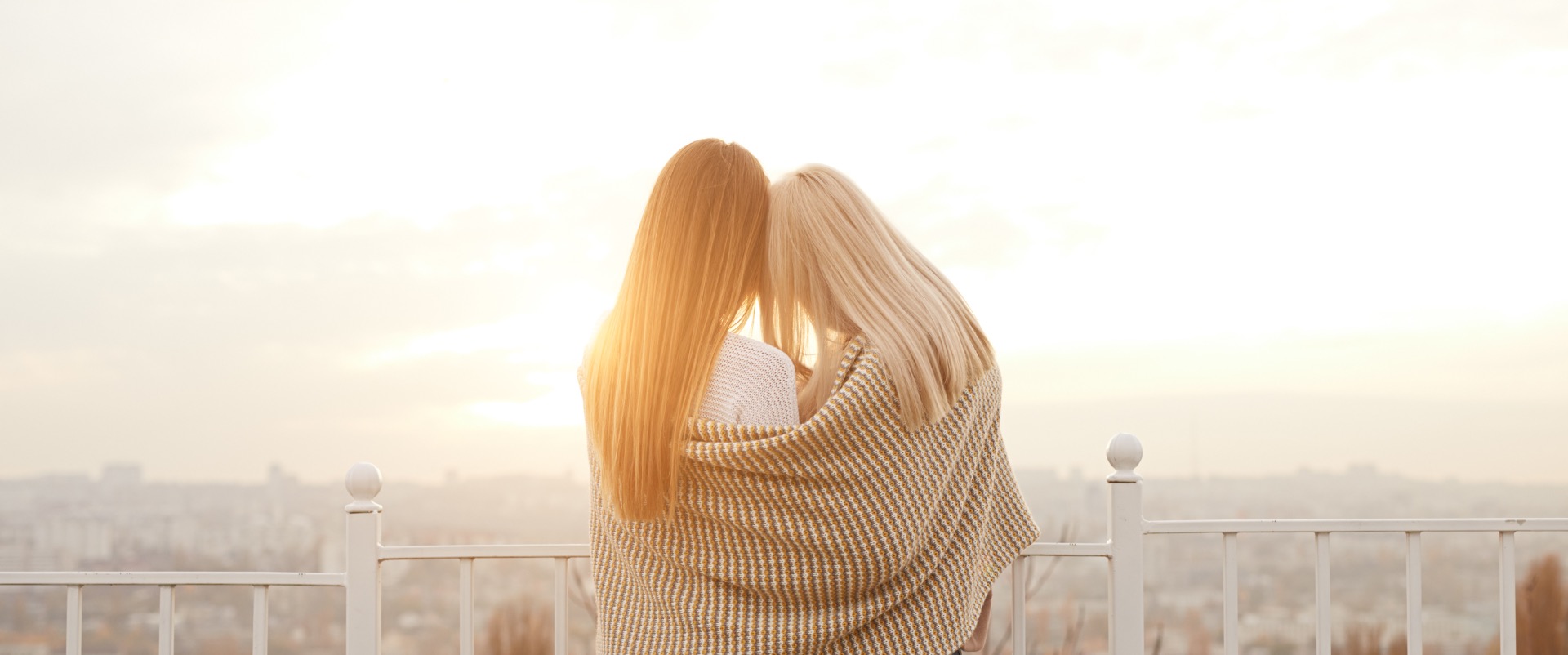 Couple looking out on a balcony