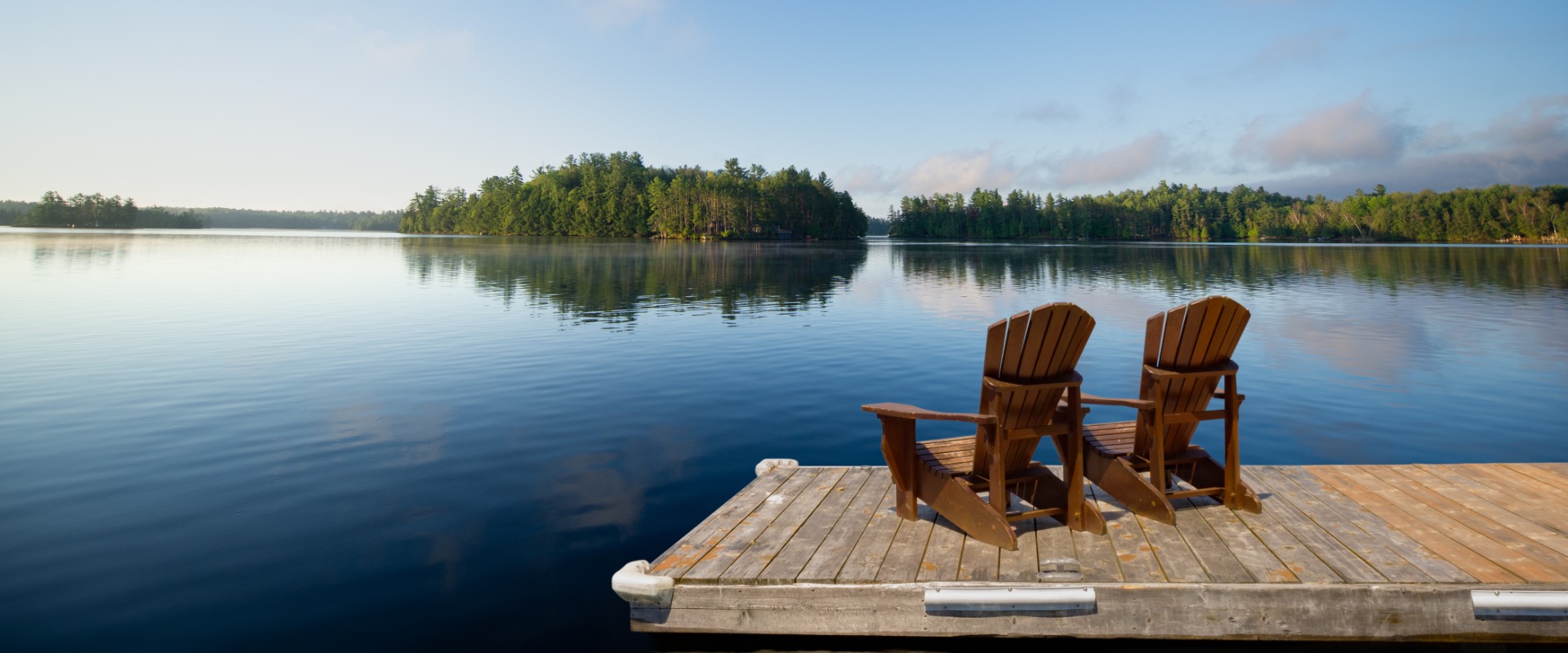 Lake dock with chairs.